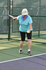 Helga Stone serves the ball towards the baskets set up by mentor Bill Reynolds. undefined