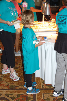 A child getting a hot breakfast at the 2013 Walkathon. undefined