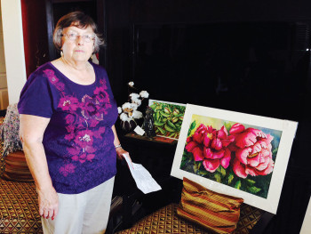 Sharon Morey and her watercolor painting undefined