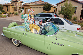 A surprise parade entry by a Mr. Ed Robson imposter Paul Lapotosky in a lime green T-Bird driven by Steve Garceau. undefined