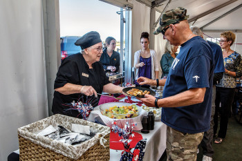 Mary LeCompte, Bistro Viente kitchen manager, serving breakfast to former Marine Jack Smith with support being provided by Andrea Marchus, administration and facilities coordinator for SaddleBrooke Ranch, and Dani Herbert, Bistro Viente assistant supervisor. undefined