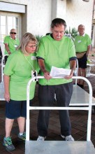 Volunteers prepare to assist exhibitors with set-up activities.
