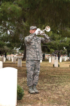 Sgt. Jose Barraza playing taps on the bugle
