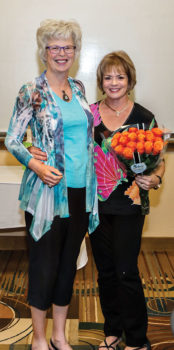Sheila Bray, Events Chair, presents roses to Janice Neal, SBRTA President.