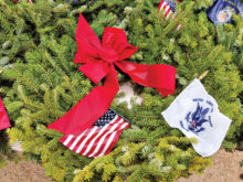 A wreath laid on a veteran’s grave at Evergreen Cemetery in Tucson