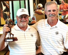 SBRMGA President’s Cup winner Robert Christianson being presented a trophy by defending champion and SBRMGA Secretary Bruce Deverman.
