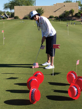 Putting with patriotic obstacles.