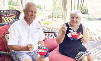 Tony and Linda Zoellner enjoy a bowl of Blue Bell ice cream at the Texas Club event, “Bluebonnets and Blue Bell.”