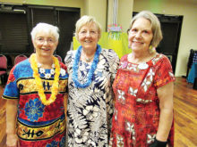 Ranchero Rebecca Williams (center) joins friends Linda Lewis (left) and Kathy Smith (right) in dancing to the music of the Islands.
