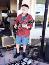 Guitarist Rick Still providing entertainment at a neighborhood party. Photo by Diane Still.