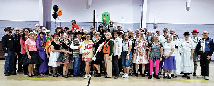 Rancheros and SaddleBrooke Squares enjoy costumes and dancing on Halloween.