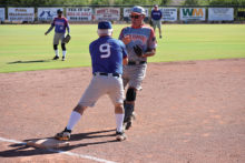 Dave Kraut tags out Tim Benjamin on a close play at third base in a recent Senior Softball Recreation League game at SaddleBrooke. The league is open to all Ranch residents.