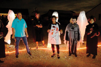 Creators of many of the evening’s props and the Ghost Hosts gather at the Haunted Vacant Ground after the Walking Ghost Tours during Unit 8A’s Halloween “Night of Fright.” Left to right: Bob Townsend, props creator and carpenter, Ghost Hosts Morbid Mona (Marci Whitehead), Bertha the Butcher (Judie Townsend), Scary Mary (Kate Thomsen), and Francis Fraidy Cat (Janelle Authur).