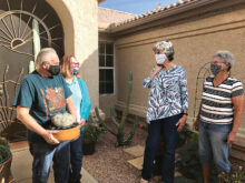 Master Gardeners presenting Fred and Pat Flanagan with a gift of gratitude for their many years of service.