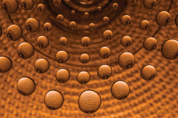 Water Droplets - martini glass on place mat cropped in gold (Photo by Bob Hills)