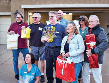 Eight raffle prizes were awarded at Unit 8A’s “Drive-In” Through the Years event in March. Prize winners were Maia Schenkel (front), (left to right) Bob Townsend, Paul Picchiottino, Ron Dennis, Kevin Hand (background), Betty Ryan, Vicki Froistad, and Dick Ryan.