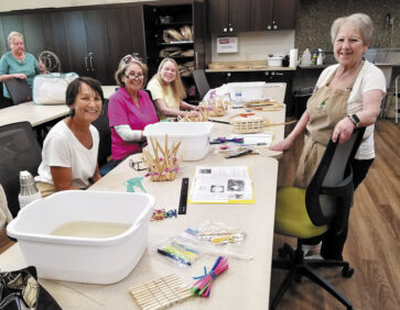Lydia Reichard teaches basket weaving techniques.
