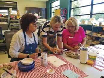 Terri Thomas demonstrates a glazing application.