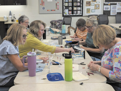 Beaders crafting earrings during a class (photo by Elaine Cassara)